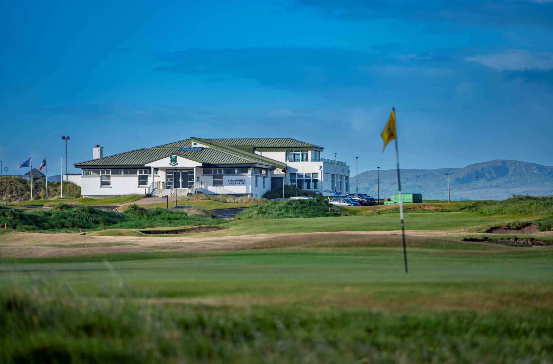 Hole 10 - The Road - up close of 10th green with clubhouse in view in the background