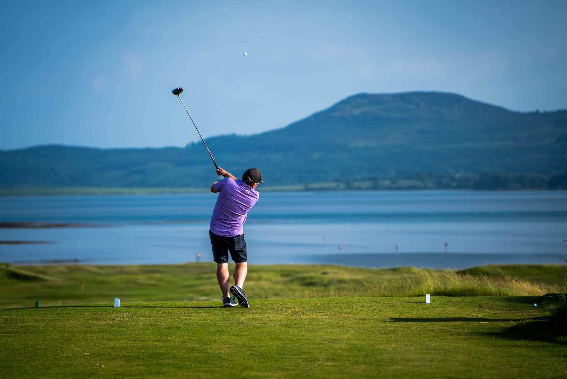 Man teeing off on hole 1