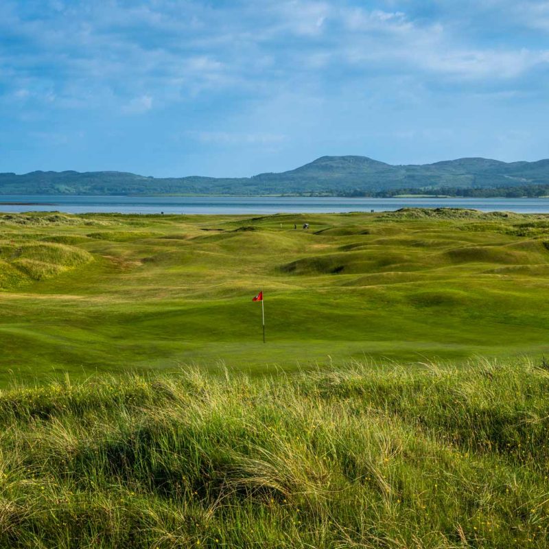 The ocean in the distance, with the golf course in the foreground