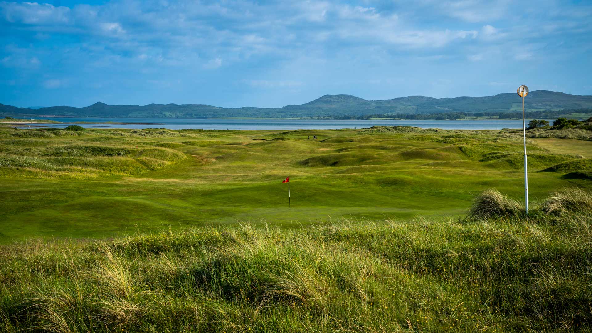 The ocean in the distance, with the golf course in the foreground